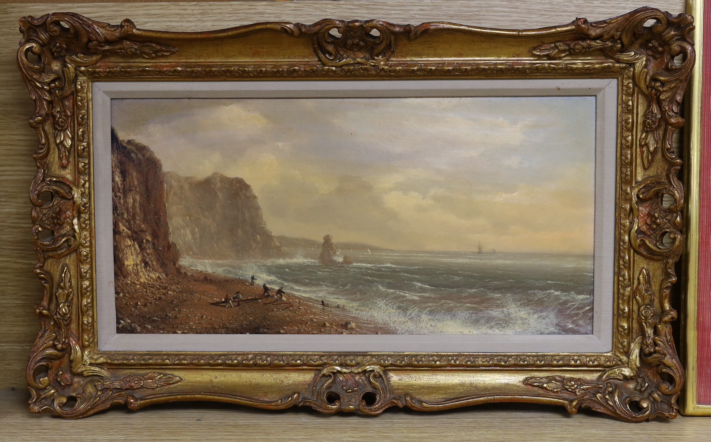 Attributed to Frederick John Widgery (1861-1942), oil on canvas, 'Figures gathering driftwood from a wreck', signed, 20 x 40cm